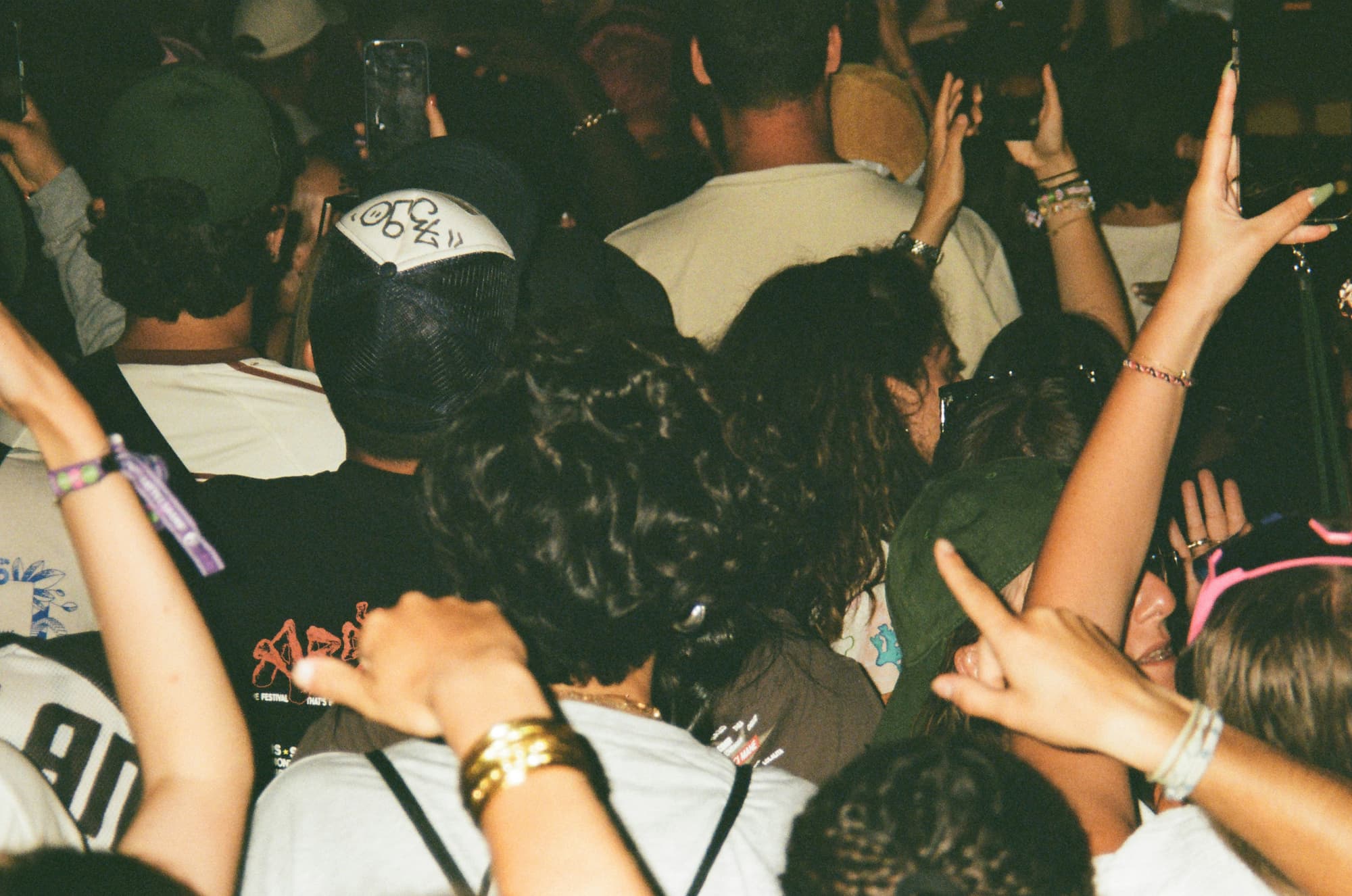 A crowd with hands in the air