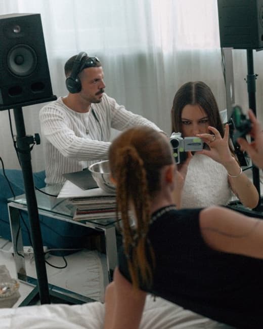 A guest filming with a camcorder at a launch