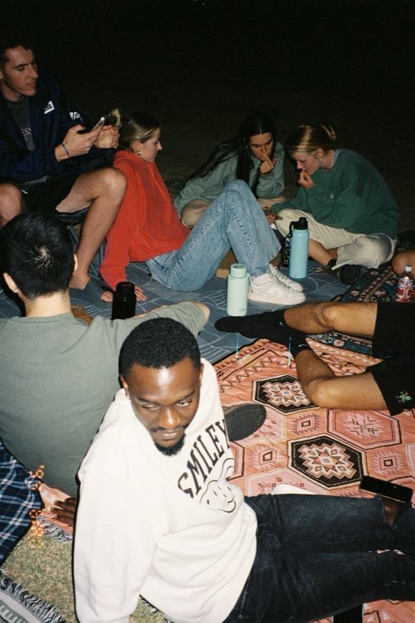 Friends laughing around a pub table