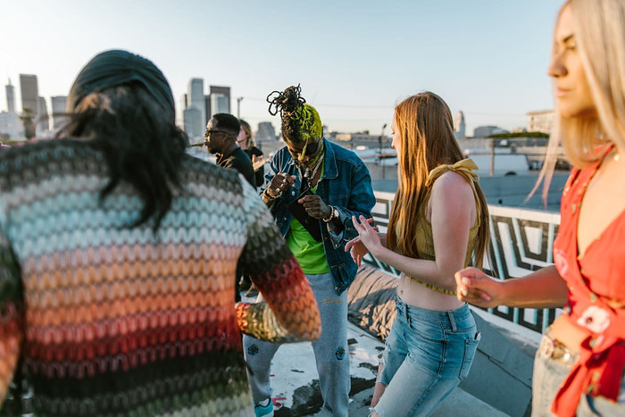 Guests arriving on a city rooftop